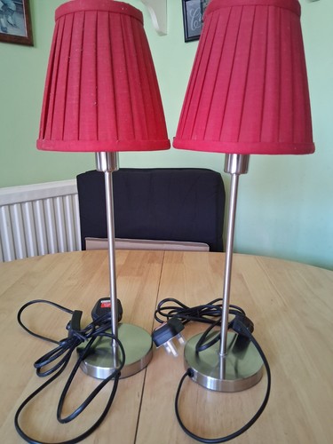 Pair tall chrome lamps with - of,